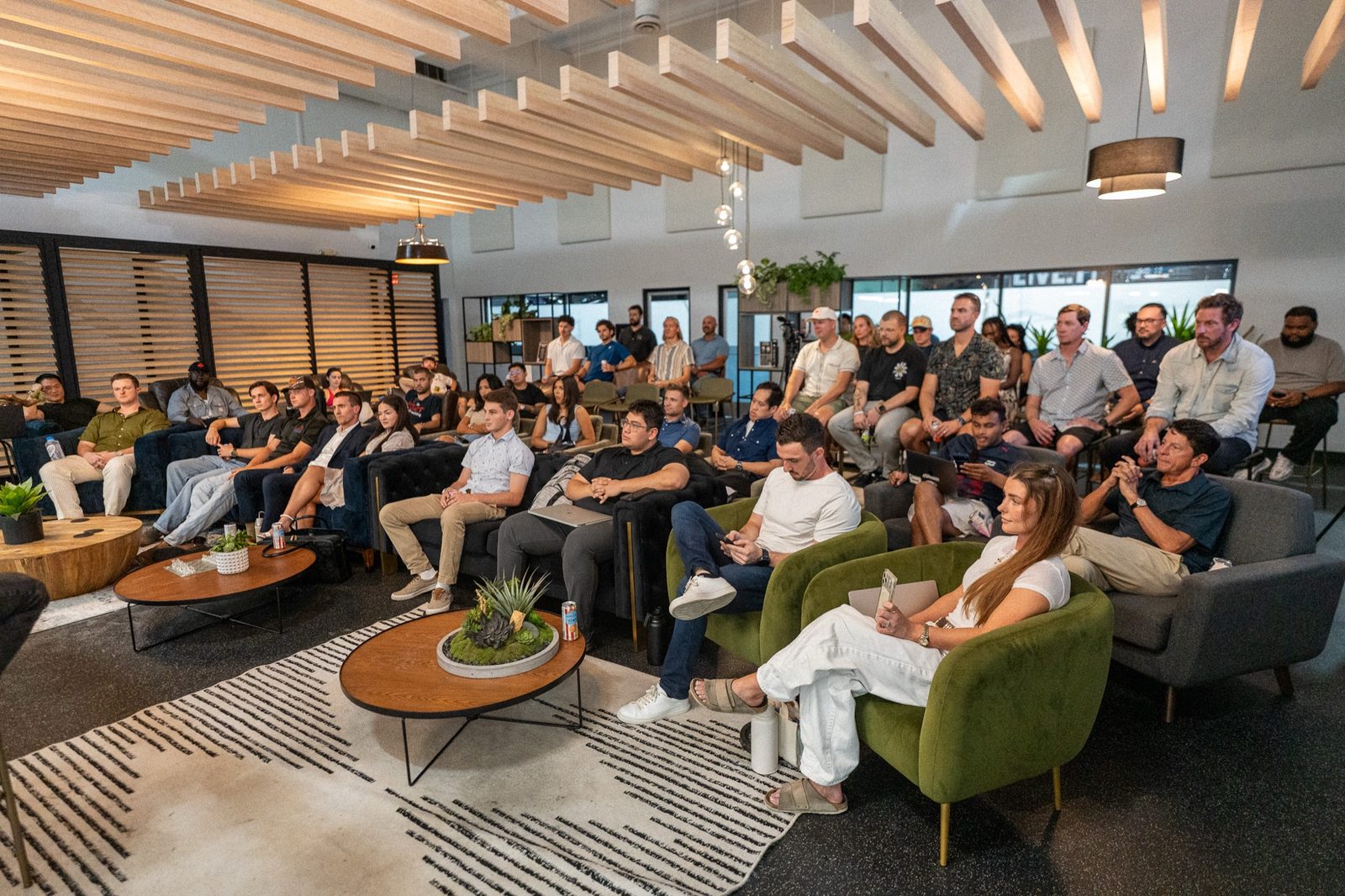 The Network of Directors room at North Kollective in Austin, seen from the back of the room during a talk